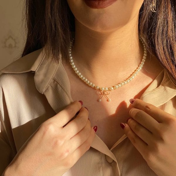 گردنبند گوی و مروارید آویز پاپیون